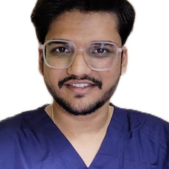 A professional portrait of a male individual in medical scrubs, wearing glasses, and smiling in a clinical or laboratory setting.